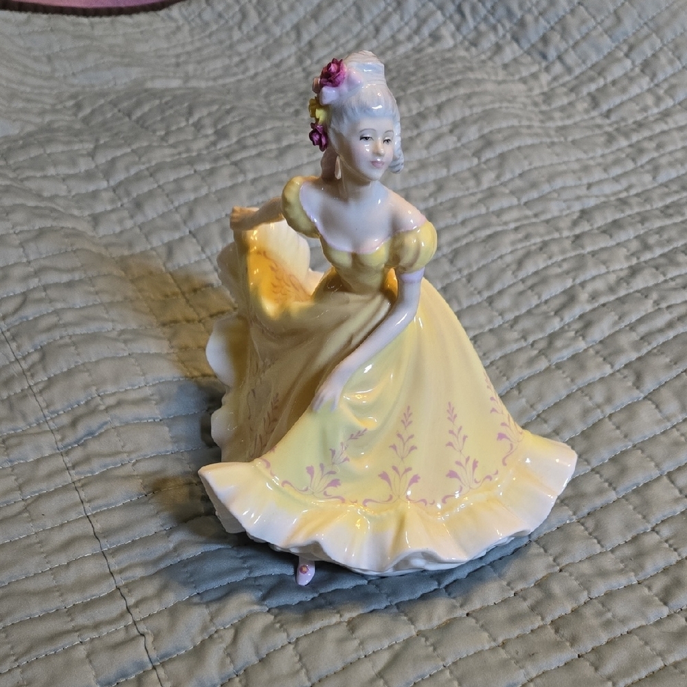Elegant Yellow Porcelain Figurine